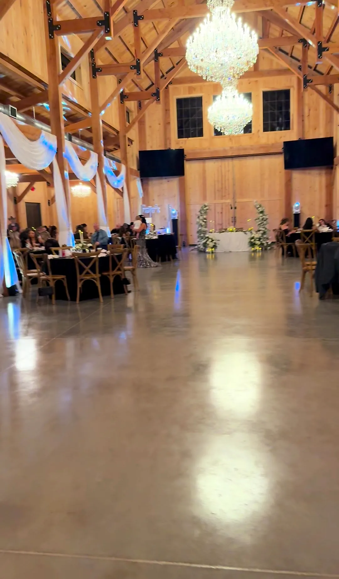 Rustic barn event venue with soaring wood beams, crystal chandeliers and polished floors in Alva, east of Fort Myers